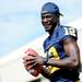 Michigan junior quarterback Devin Gardner smiles as he tosses the ball around during media day at the Al Glick Field House on Sunday afternoon. Melanie Maxwell I AnnArbor.com